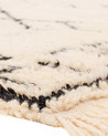 black and beige rug - 209 €