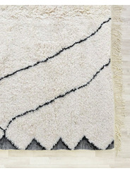 cream and black rug - 240 €