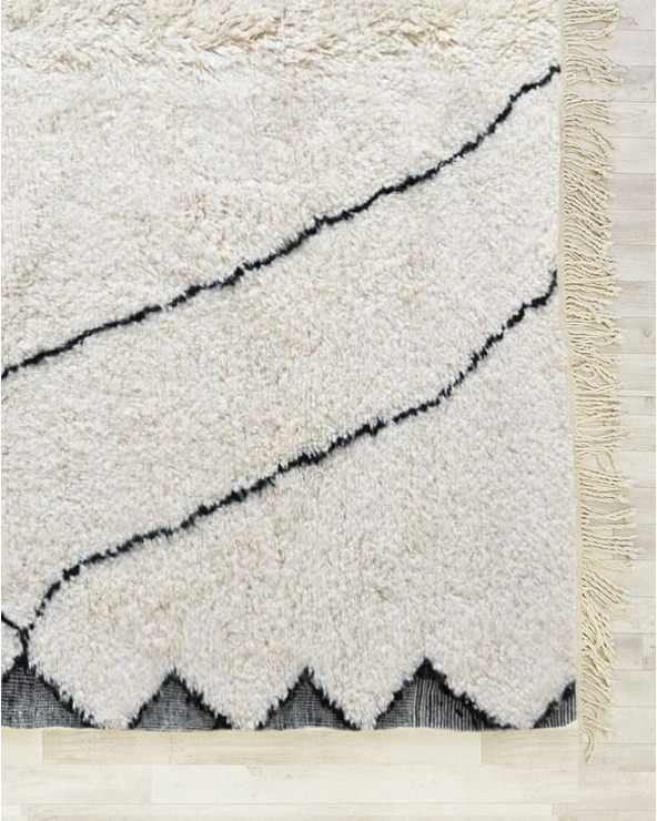 cream and black rug - 240 €