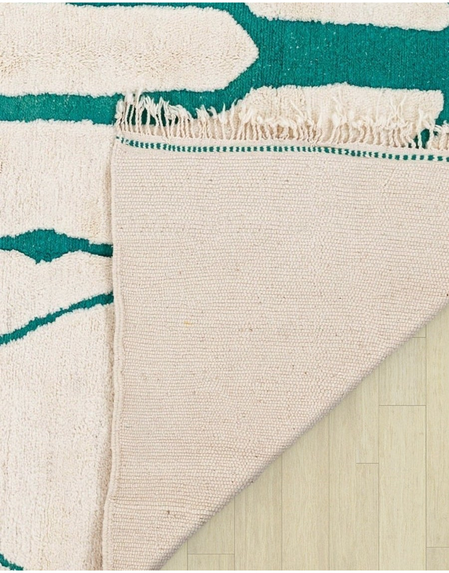 cream and green rug - 109 €